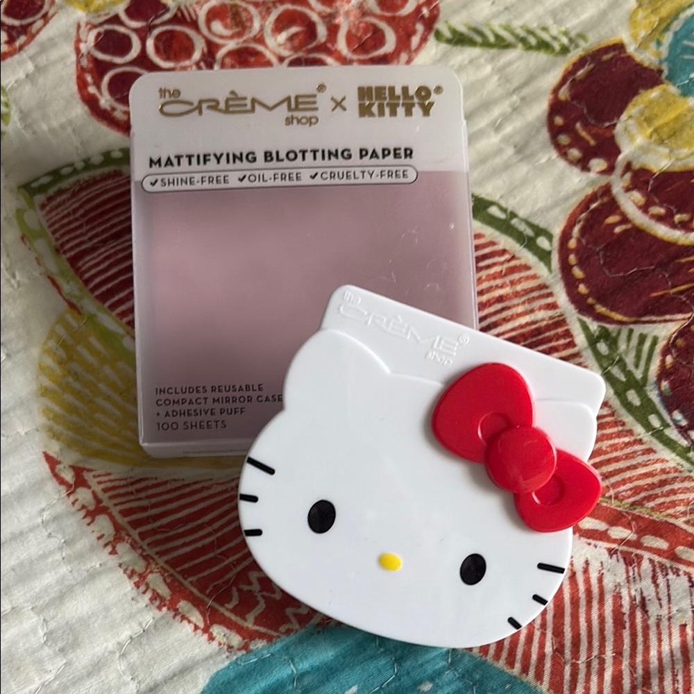 the Crème x Hello Kitty Mattifying Blotting Paper - White & Red Hello Kitty Case
